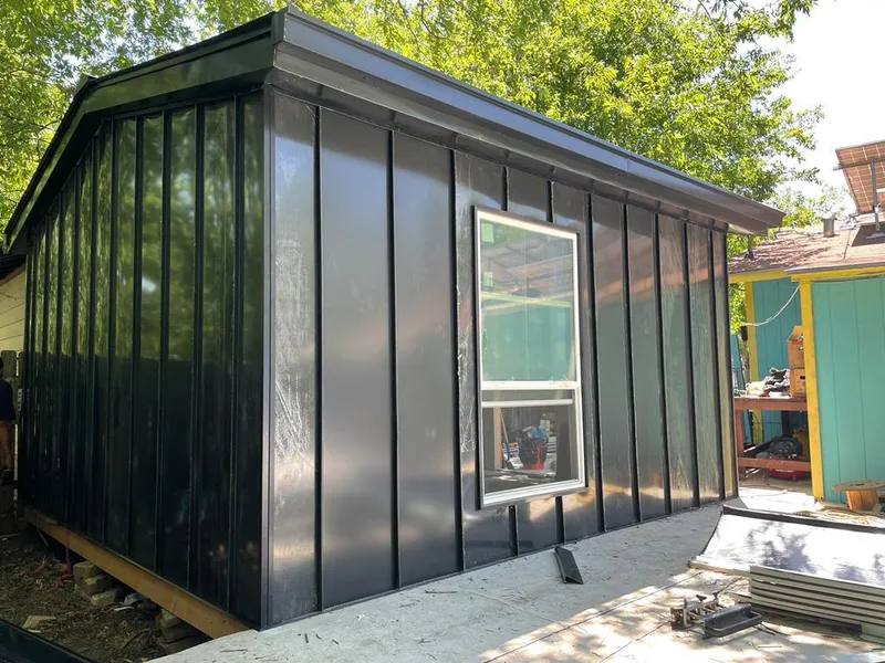 Black standing seam metal wall panels for Roof Inspection in Montrose-Ghent