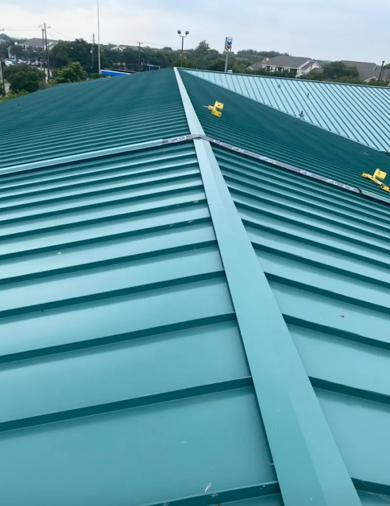 Green commercial metal roof ridge and valley for Metal Roof Repair in Montrose-Ghent